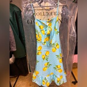 Spring/ summer dress w adj straps & bow. Blue w white polka dot & lemon print